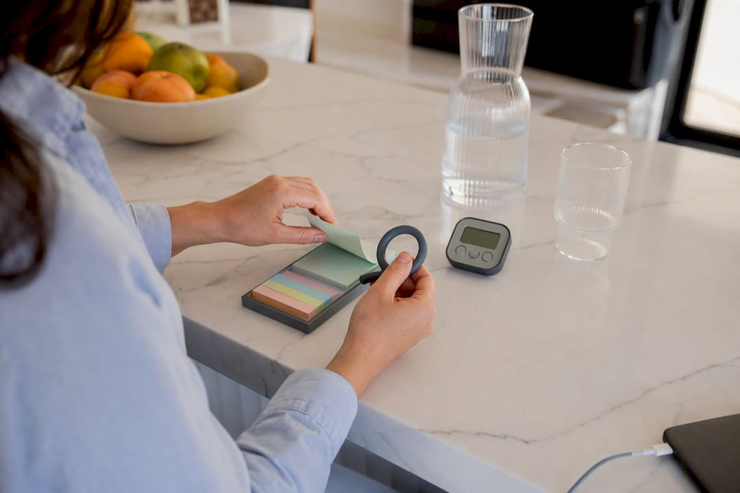 Hands using organization tools on desk