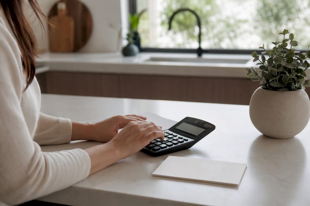 Hands using calculator for therapy costs